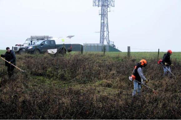 Clearing NW corner of the site, the site of a barn. Looking towards what has become an a major landmark – a television aerial marking the top of Newmarket Hill; 10th January 2013.