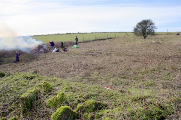 From rubble mound lokking SW over back garden to south end of farmyard