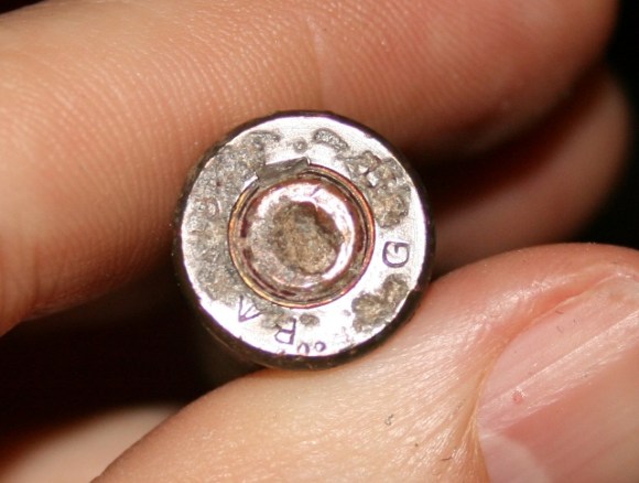 Red paint on annular ring disappearing as stubborn dirt is also being removed.