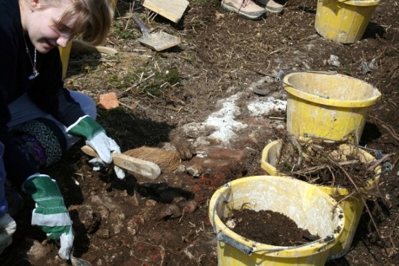 Uncovering the E wall of the house
