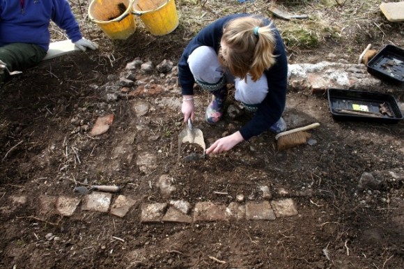 Trench 1A showing un-mortared bricks on E edge