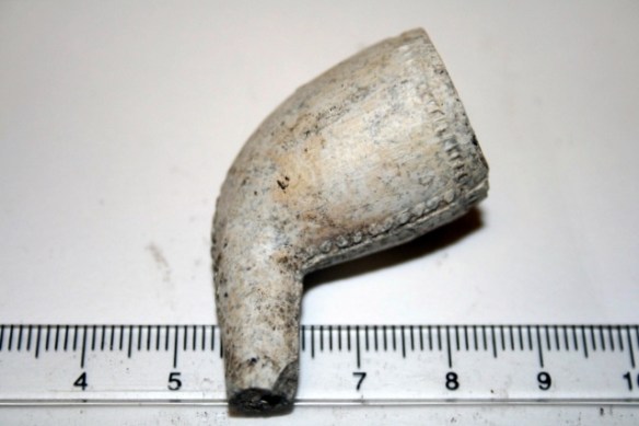 Decorated clay pipe bowl, 19th c.(?) from rubble mound