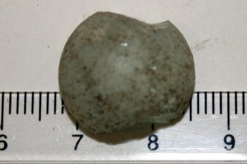 Half a broken marble from a Codd Bottle, from the surface of the rubble mound