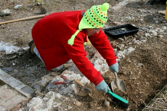 Excavating chalk rubble surface against side of house