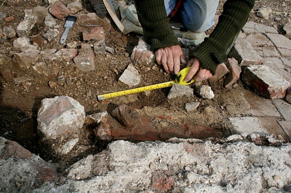 Tiled floor under stairs