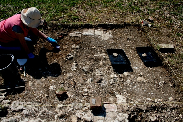 Excavating fill of 'lean-to' construction