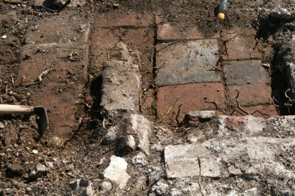 Part of front door at N gable end of house