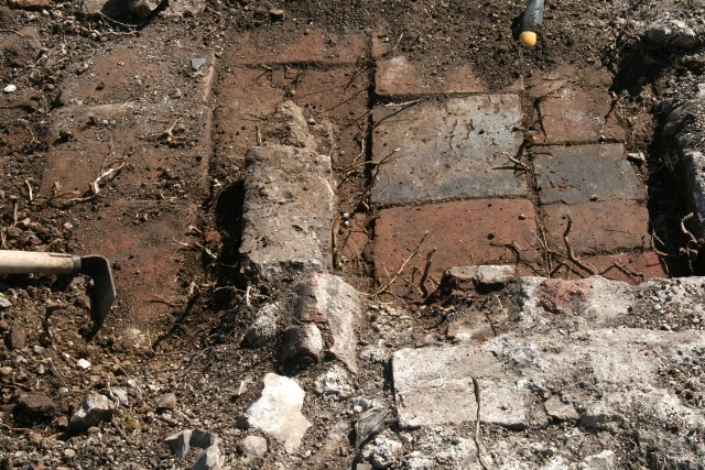 Part of front door at N gable end of house