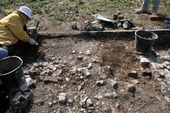 Partial excavation of W wall of lean-to-structure to S of house