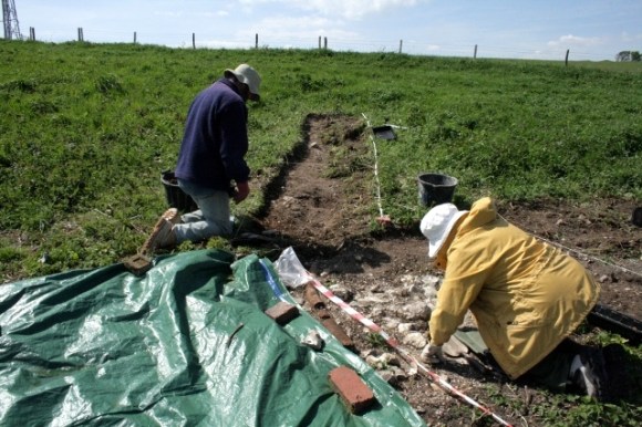 Looking NW along line of water-pipe from NW end of house, towards NE corner of big barn