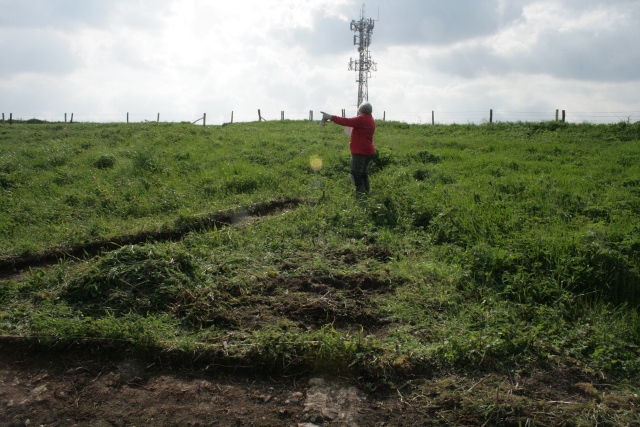 Peggy showing probable location of near corner of barn