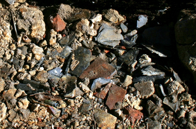 Roof slates, etc under corrugated iron sheet