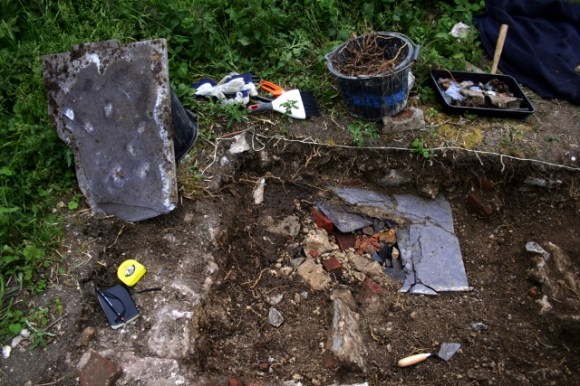 Demolition rubble under slate slab