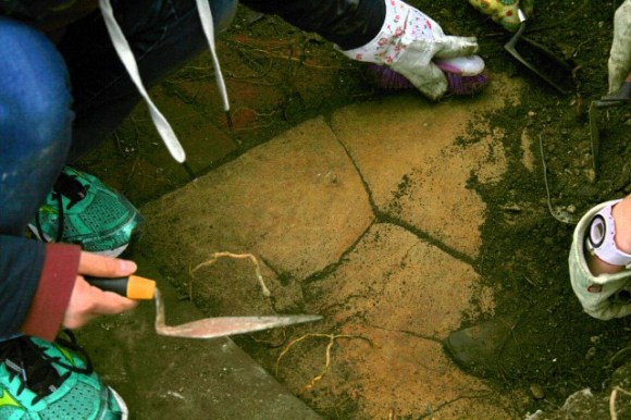 Brick edged stone floor of outside toilet