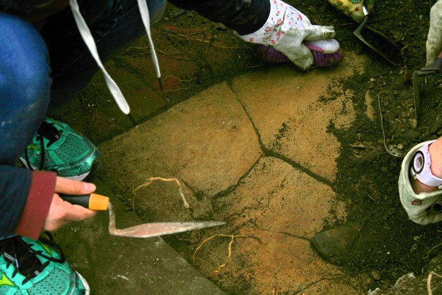 Brick edged stone floor of outside toilet