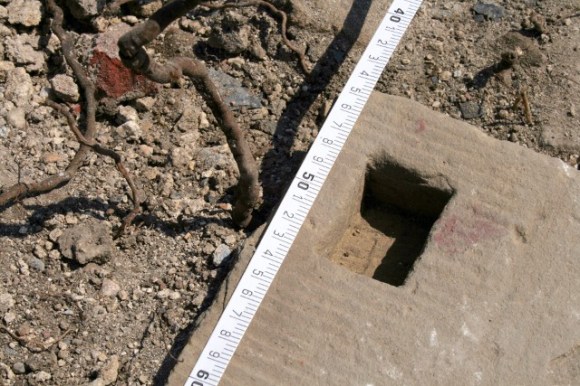 Slot for toilet door hinge