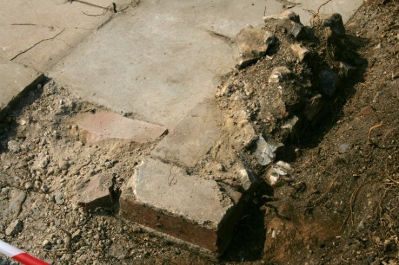 SE corner of toilet wall