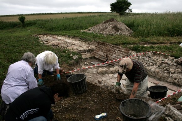 Excavating area E of toilet, S of garden boundary wall