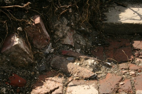 Cast iron gutter on brick paved path to front door