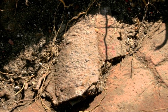 Collapsed cast iron guttering on path to front door