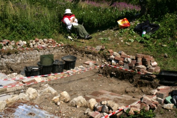 Looking NE from NW corner of house across path between front door, toilet to left and front garden gate to the right 