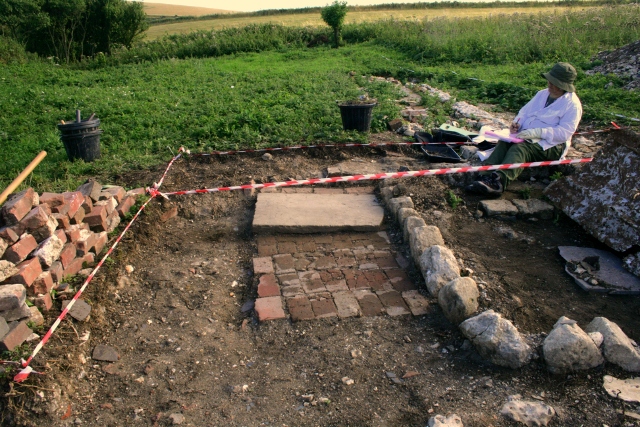 Looking S from garden boundary wall down path to front door