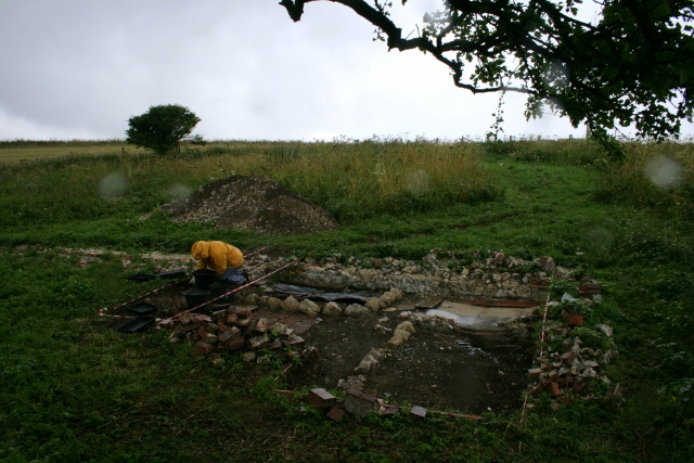 View SW over front garden from N edge of rubble mound near NE corner of garden
