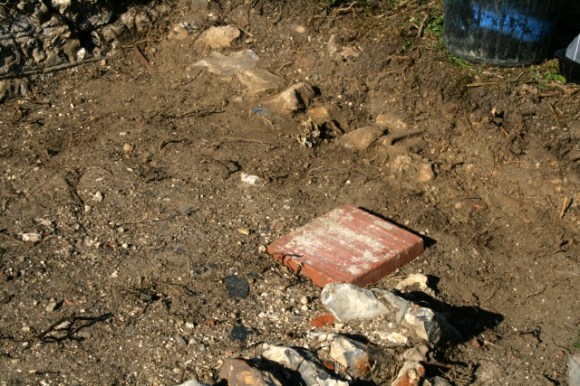 Edging stones N and W of path to front gate
