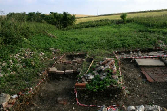 Looking S from W side of front gateway towards E side of front of house