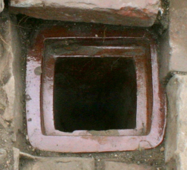 Gulley drain in front of junction of scullery/kitchen and woodshed