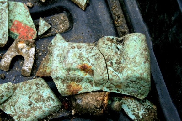 Green painted(?) plaster(?) shards of mystery object