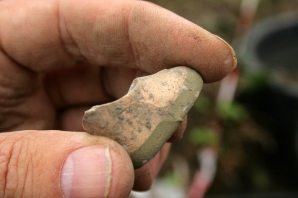 Painted dolls foot wearing a shoe