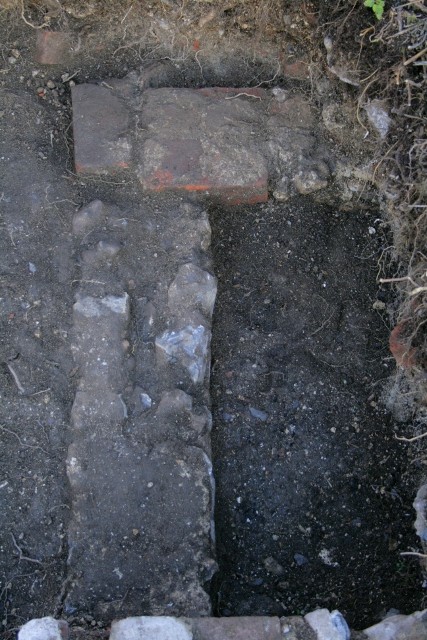 Looking E across entrance to shed