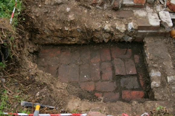 Looking W at 'woodstore' against E side of cottage's N frontage