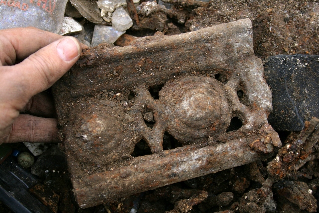 Part of a cast iron coal grate?