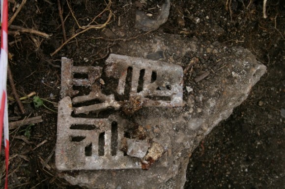 Fragmented cast iron grating, probably for our gully drain
