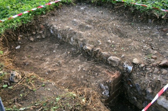 Looking SW at a mortar surface S of the 'woodstore', E of the kitchen
