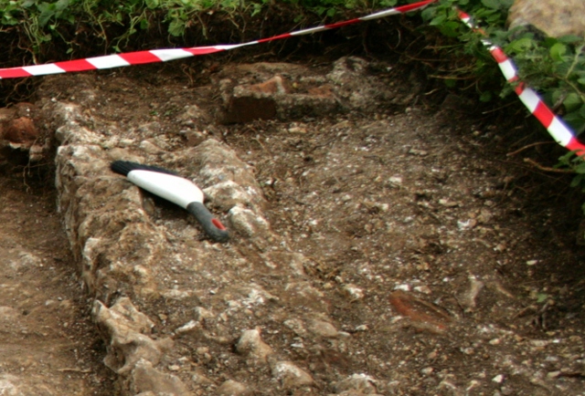 Looking S at foundations of E & S walls of kitchen