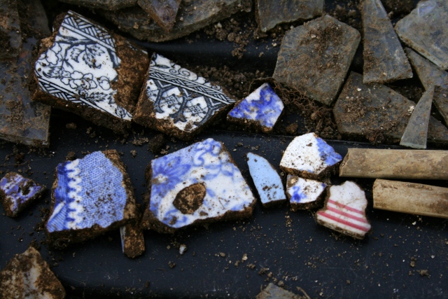 Decorative ceramic shards and clay pipe stems