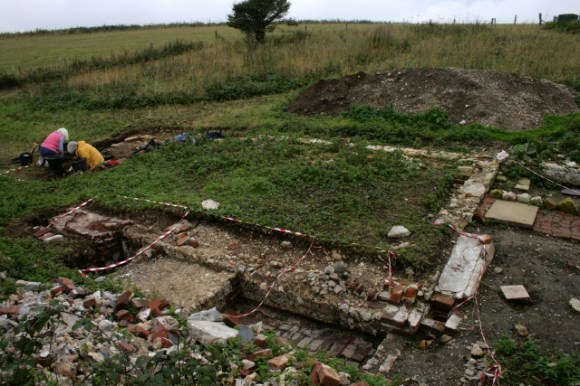 Looking SW over dig site from rubble mound