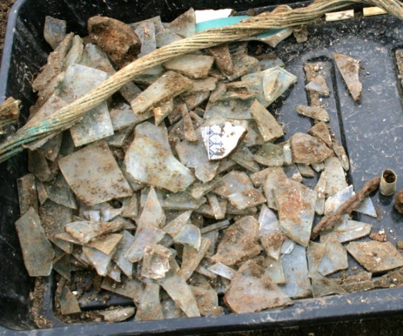 Window glass fragments from area roughly outside NE corner of extension