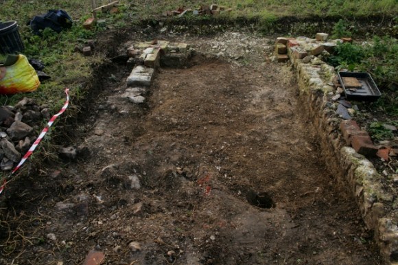 Looking W at foundations of extension at S end of cottage