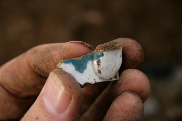 Cup handle shard from partially excavated grid square S of cottage, E of ~1880 extension