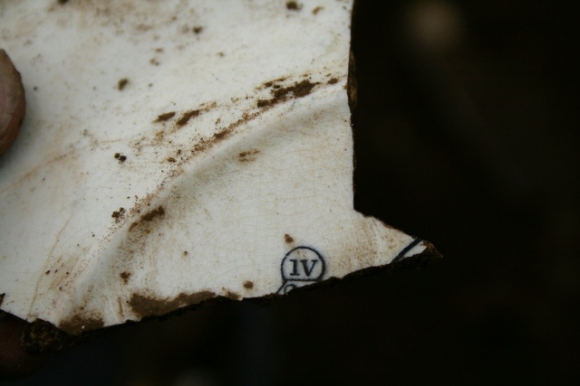 Reverse of decorated dinner plate shard from partially excavated grid square S of cottage, E of ~1880 extension