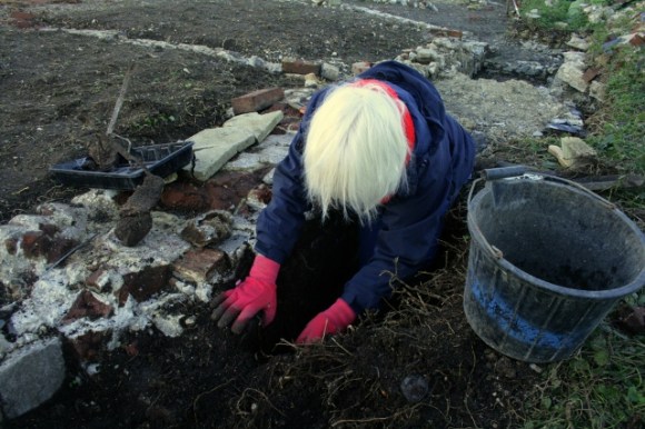 Looking NW at excavation of external face of chimney base