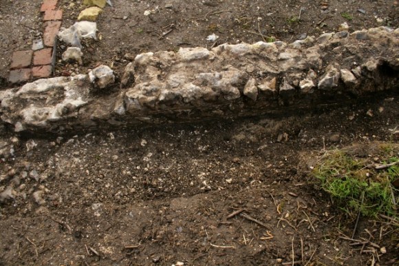 Looking S at W side of garden gateway and N side of N boundary wall