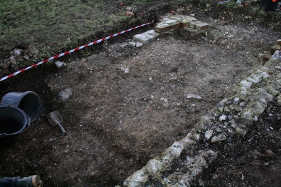 Looking SW at extension at S end of cottage