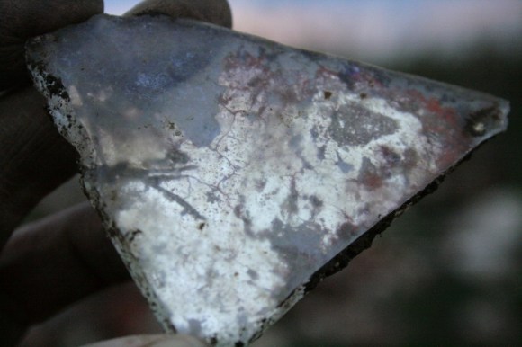 Mirror glass showing decaying silvering at back