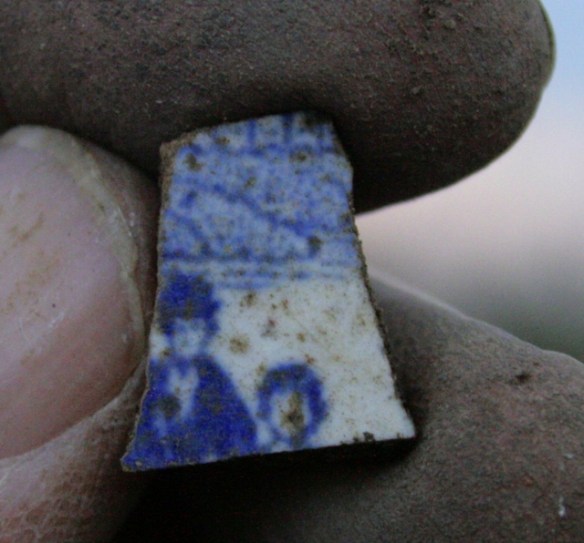 Blue and white ceramic; decorated with image of 2 figures