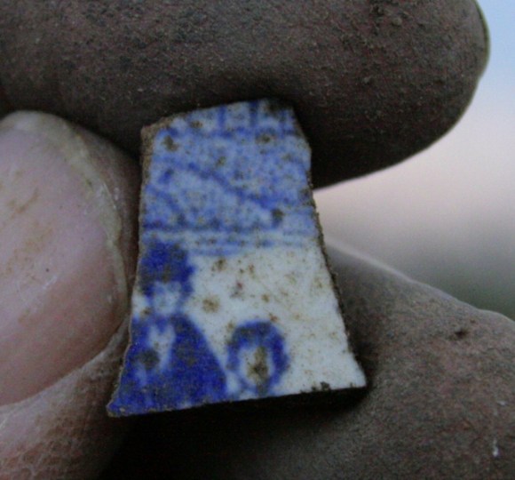 Blue and white ceramic; decorated with image of 2 figures